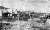 Main Street, Waikino Mr Bob Shaw on cart.